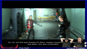 Graham and Alex watching a cutscene in Alpha Prime. Two men stand in a hallway, one holding a large gun. The one without the gun is saying, "No, no, not that way! Scongiuro! Many, maaany mutants. [Text obscured by Graham and Alex] and down. Nice and comfortable."