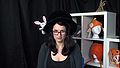Kathleen wears a top hat with a rabbit in it in Things Get Weird with Andy.