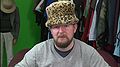Graham wears a leopard print hat donated by Ben, creator of Düdle, in What do Possums Eat?.